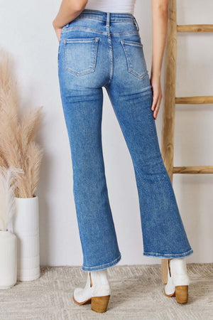 Risen high rise ankle flare jeans in blue, showcasing back view with flattering fit and stylish design.