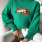 Green Bella Road Lip Turtleneck Sweater with bold lip design, featuring moderate stretch and playful style for unique fashion statements.