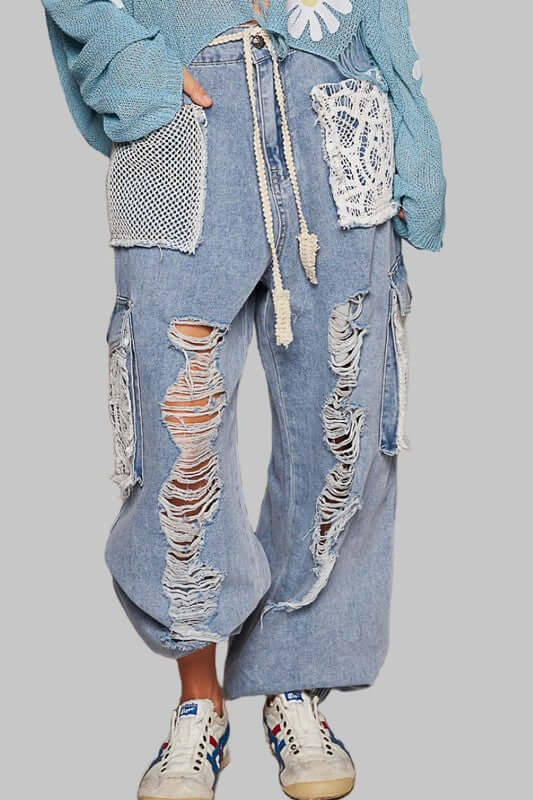 Stylish POL crochet patch distressed washed jeans with unique detailing and trendy bohemian flair. Perfect for any outfit!