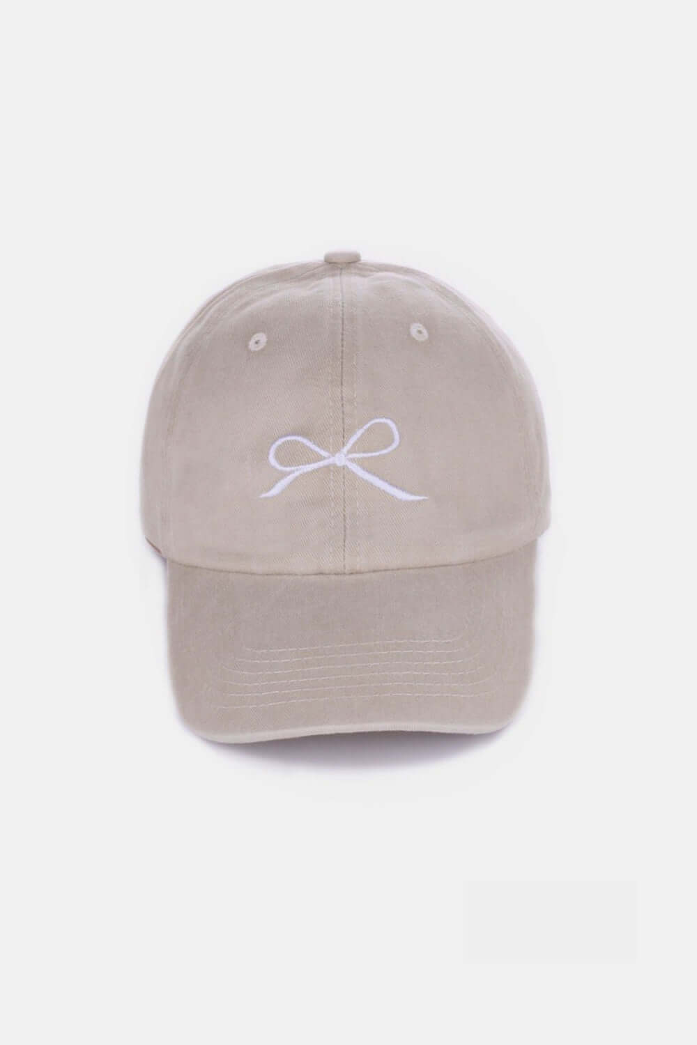 Bow Embroidered Washed Cotton Cap in beige with delicate bow design on front, breathable and stylish accessory for all-day wear.