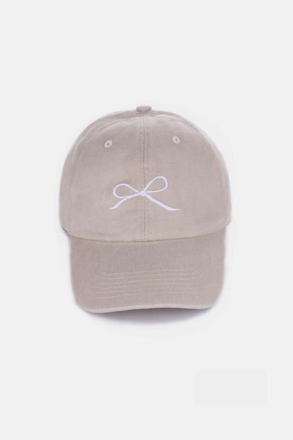 Bow Embroidered Washed Cotton Cap in beige with delicate bow design on front, breathable and stylish accessory for all-day wear.