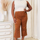 Woman wearing Judy Blue Jeans tummy control garment-dyed wide crop pants in a chic and modern straight-leg design.