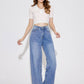 Woman wearing Bella Road High Waist Straight Leg Jeans with Pockets and a white crop top