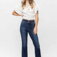 Woman wearing Judy Blue Frayed Hem Bootcut Jeans with white lace top and sandals