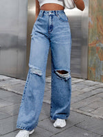 Bella Road Distressed Wide Leg Jeans with pockets for stylish road trips, featuring a relaxed fit and unique ripped design.