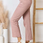 High Rise Ankle Flare Jeans in pink showcasing a chic, modern style with a flattering silhouette and slight stretch. Risen Jeans.