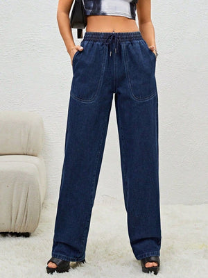 Woman wearing Bella Road Drawstring Elastic Waist Jeans with Pockets for a relaxed and trendy look