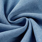 Close-up of soft light wash denim fabric in a swirling pattern, showcasing its texture and quality.