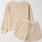 Cozy Bella Road quilted two-piece set with round neck top and shorts in soft beige, perfect for lounging or casual outings.