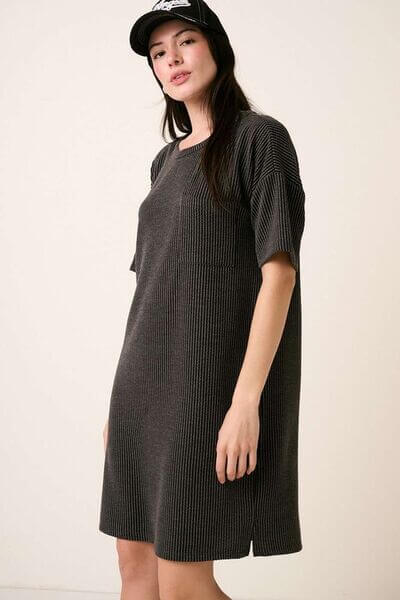 Stylish woman wearing a Mittoshop Urban Rib Knit Short Sleeve Tee Dress, pairing casual comfort with modern flair.