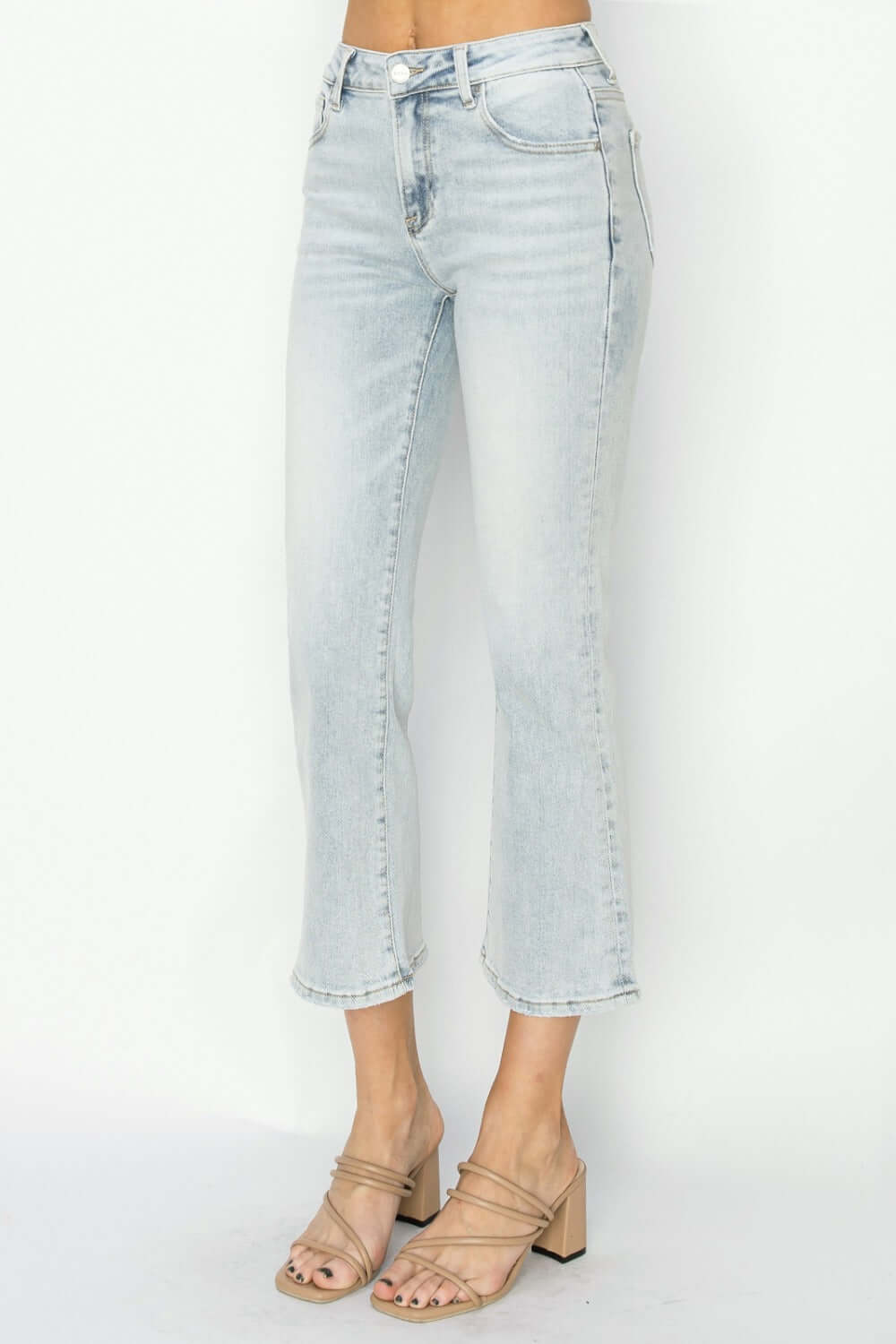 RISEN Full Size Mid Rise Cropped Flare Jeans showcasing modern cropped length and retro flare, highlighting stylish footwear.