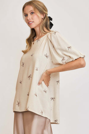 Umgee plus size linen blend top featuring ribbon embroidery and ruched sleeves, perfect for warm weather style.