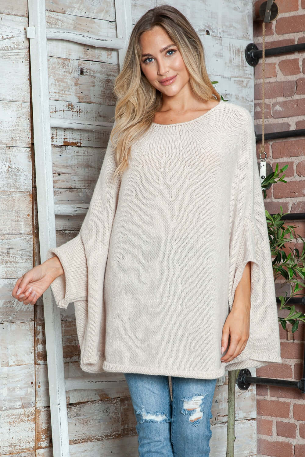 Cozy Bella Road batwing sleeve sweater in beige with round neck, perfect for a stylish and warm look.