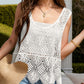 Stylish woman wearing a Bella Road Swim Cutout Wide Strap Cover-Up by the pool, showcasing a chic crochet design.