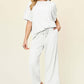 DOUBLE TAKE Full Size Texture Round Neck Short Sleeve T-Shirt and Wide Leg Pants at Bella Road