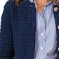 Woman wearing a Bella Road button up round neck long sleeve cardigan over a blue and white striped shirt