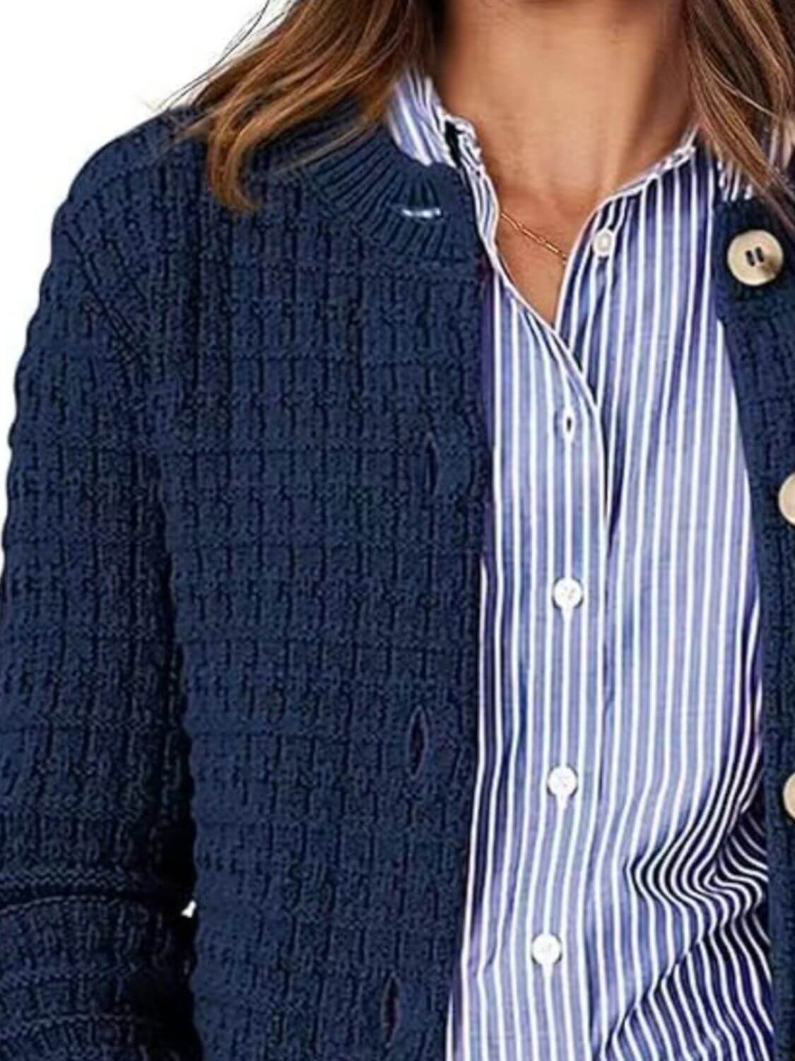 Woman wearing a Bella Road button up round neck long sleeve cardigan over a blue and white striped shirt