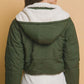 Woman wearing green cropped hooded Sherpa reversible jacket, showcasing the cozy and stylish back design for a chic winter look.