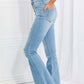 Woman wearing Vibrant MIU full size Jess button flare jeans with slight distressing and a frayed hem for a retro casual look.