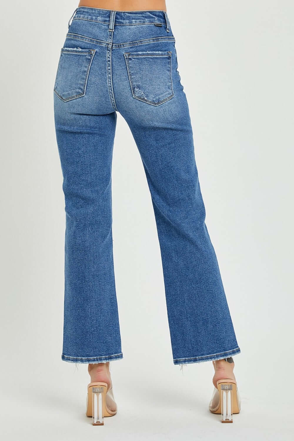 High-rise straight jeans with back pockets, flattering fit, and classic blue denim, female model wearing heels