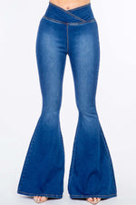 High waist pull-on flare jeans in blue denim with a sleek and modern look, featuring a comfortable fit and stretchy construction.