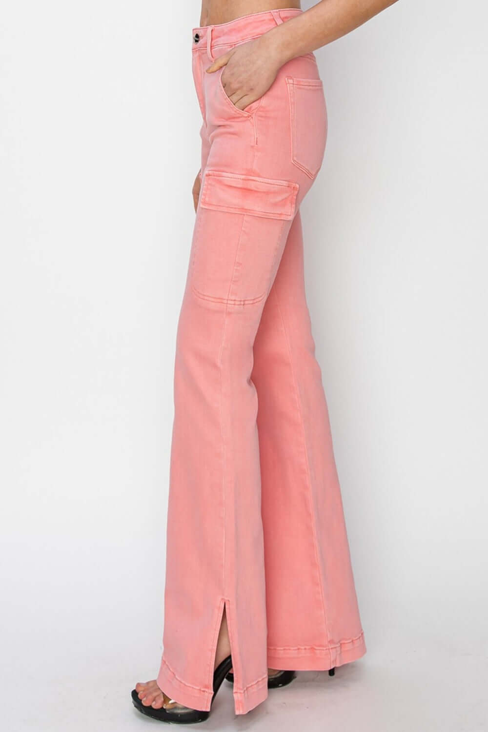 High-rise side slit cargo bootcut jeans in pink featuring flattering high waist and utilitarian pockets by Risen Jeans.