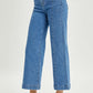 High-rise wide-leg Risen jeans for petite, styled with black heels for a chic look