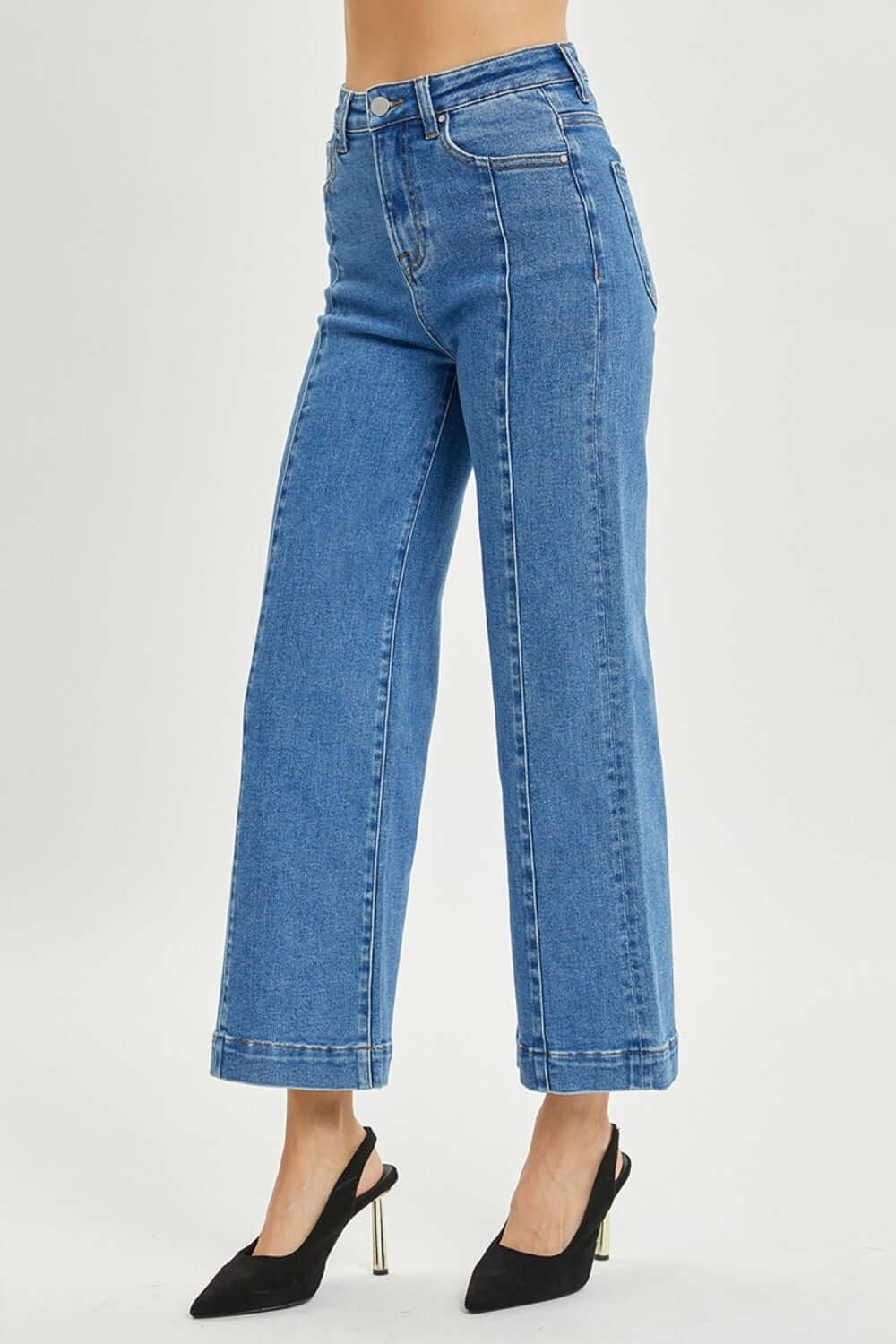 High-rise wide-leg Risen jeans for petite, styled with black heels for a chic look