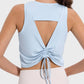 Back view of Millennia Drawstring Cutout Round Neck Active Tank in light blue, showcasing unique cutout and drawstring design.