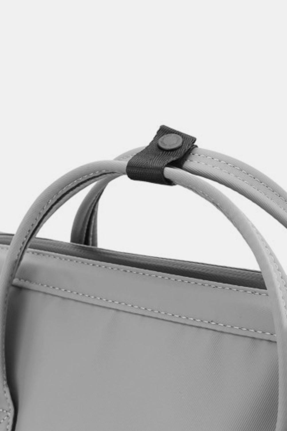 Close-up of Himawari waterproof backpack handle detail in gray PVC-coated nylon.