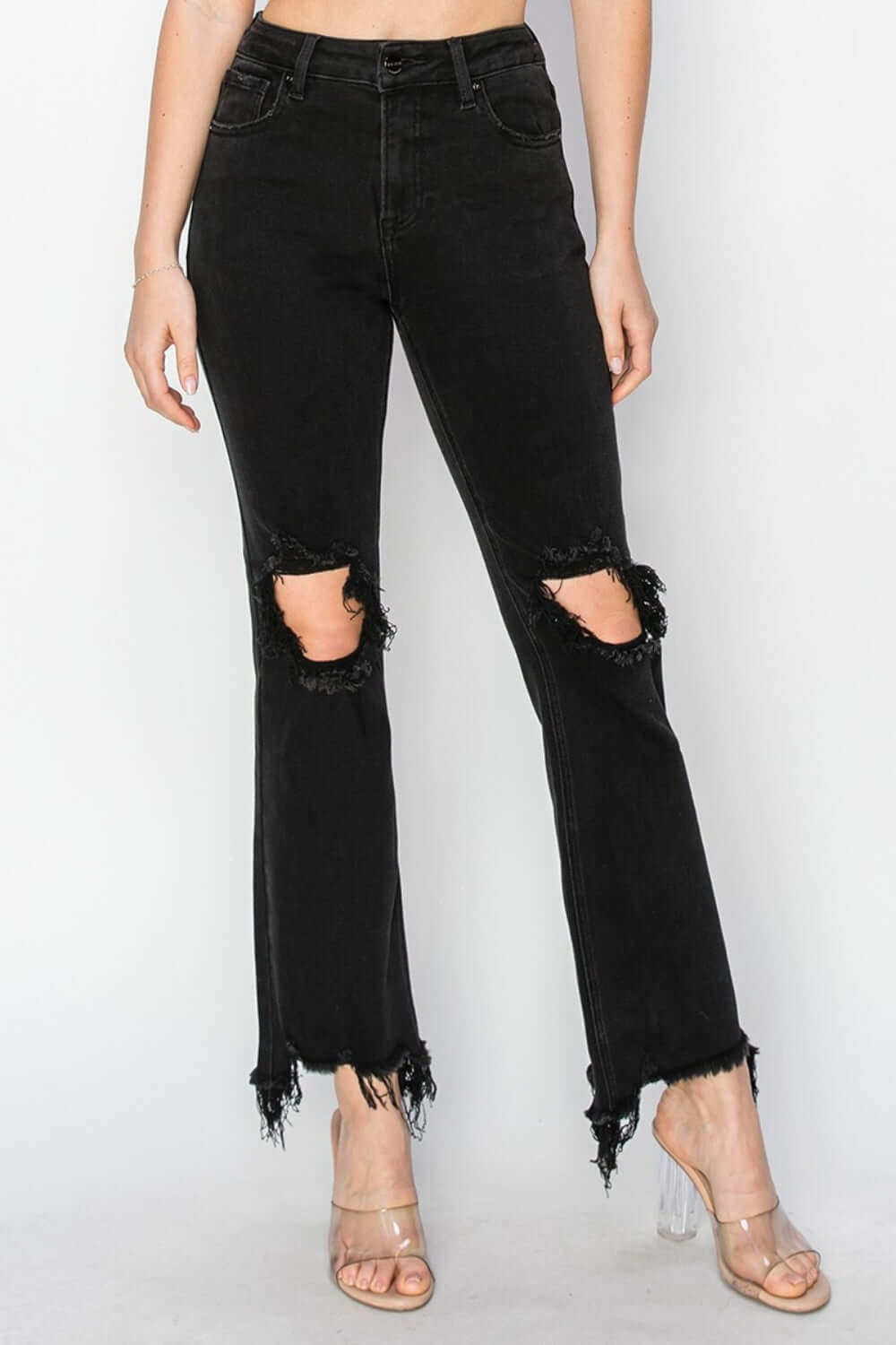 Woman wearing Distressed Raw Hem Jeans with Pockets - stylish Risen Jeans with ripped design and original cuffs for everyday or casual wear.