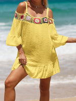 Yellow crochet cold shoulder three-quarter sleeve cover up with ruffled sheer details and floral accents, perfect for beachwear.