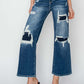 High rise Risen Jeans with patch detailing and wide leg crop for petite women, creating a trendy and edgy denim look!