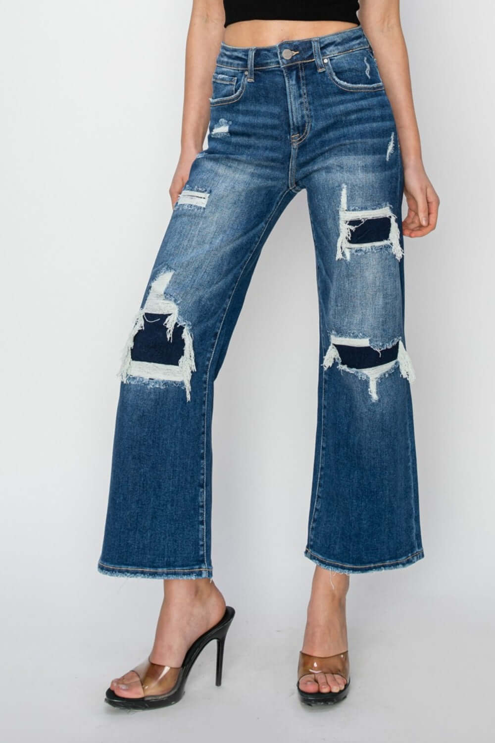 High rise Risen Jeans with patch detailing and wide leg crop for petite women, creating a trendy and edgy denim look!