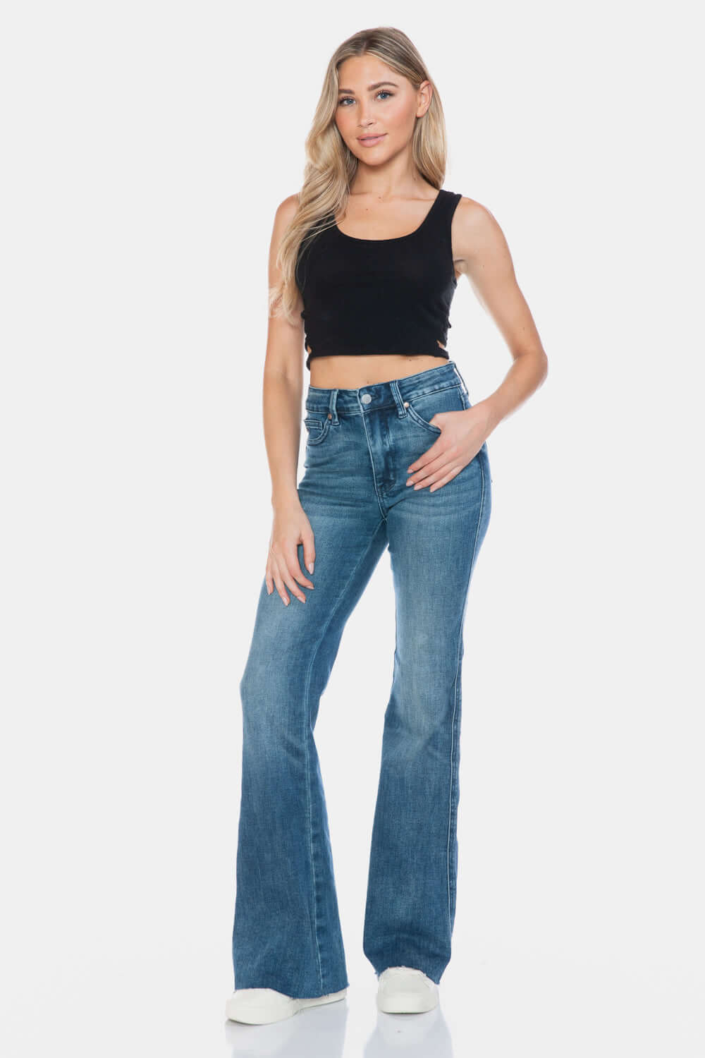 Judy Blue Tummy Control Flare Jeans with Vintage Wash and Modern Cut Hem, showcasing a chic and flattering fit for any occasion.