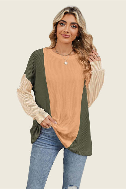 Woman wearing Double Take Texture Contrast Round Neck Long Sleeve T-Shirt in multi-color, perfect for layering or a stand-alone look.