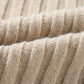 Close-up of tan cable-knit fabric from Bella Road Color Block Round Neck Sweater