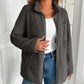 Woman wearing the Ivy Lane Zip Up Long Sleeve Fuzzy Jacket in monochrome, styled with jeans for a cozy and chic look.