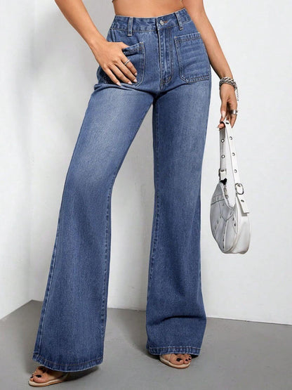 Woman wearing high waist bootcut jeans with pockets and holding a white handbag, showcasing denim styling.