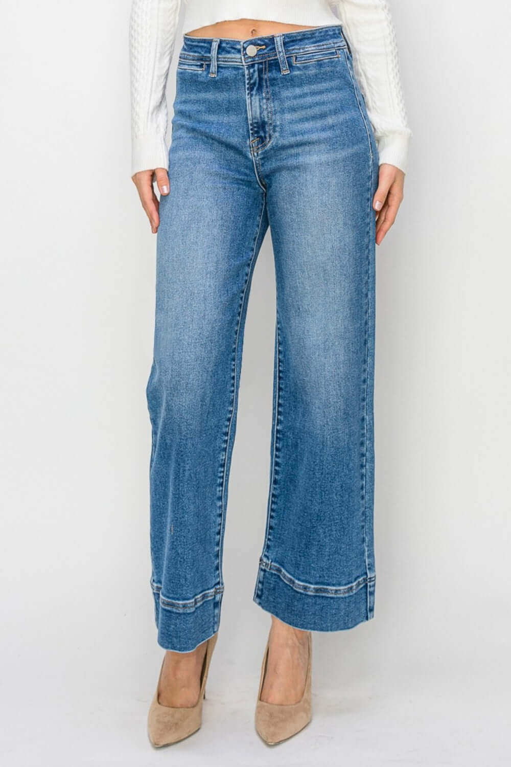 "Model wearing high rise wide leg jeans for petite, chic and on-trend Risen Jeans with a flattering, elongating silhouette and retro-inspired look"