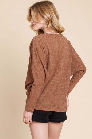 Woman wearing brown BOMBOM knit top with long dolman sleeves and black shorts, showcasing a relaxed and stylish fit.