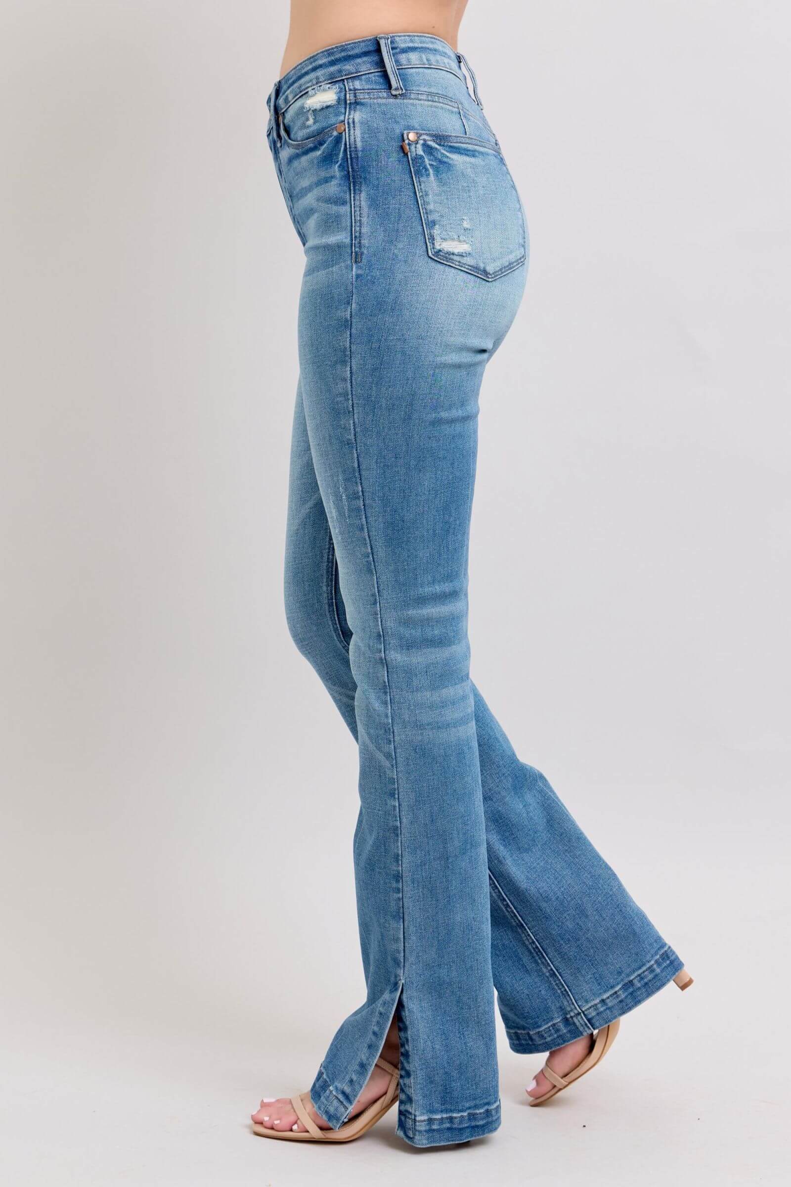 Judy Blue high waist slim bootcut jeans in vintage wash with side slit, showcasing a trendy and flattering fit.