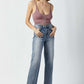 Risen Jeans high waist raw hem straight jeans worn by woman in pink top, showcasing chic and timeless style with a flattering modern fit.