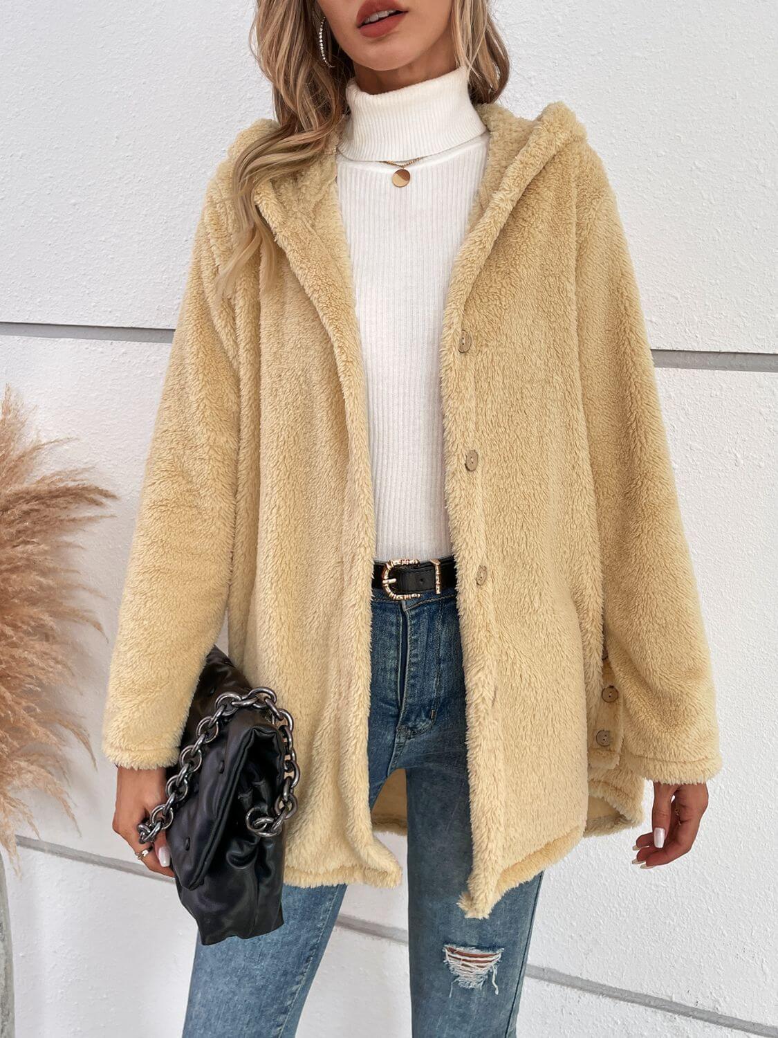 Woman wearing Bella Road Fuzzy Button Up Hooded Jacket in pastel yellow, styled with jeans and a turtleneck for chilly days.