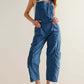 Stylish woman in medium blue Bella Road Pocketed Wide Strap Denim Overalls, perfect for fashion and function.