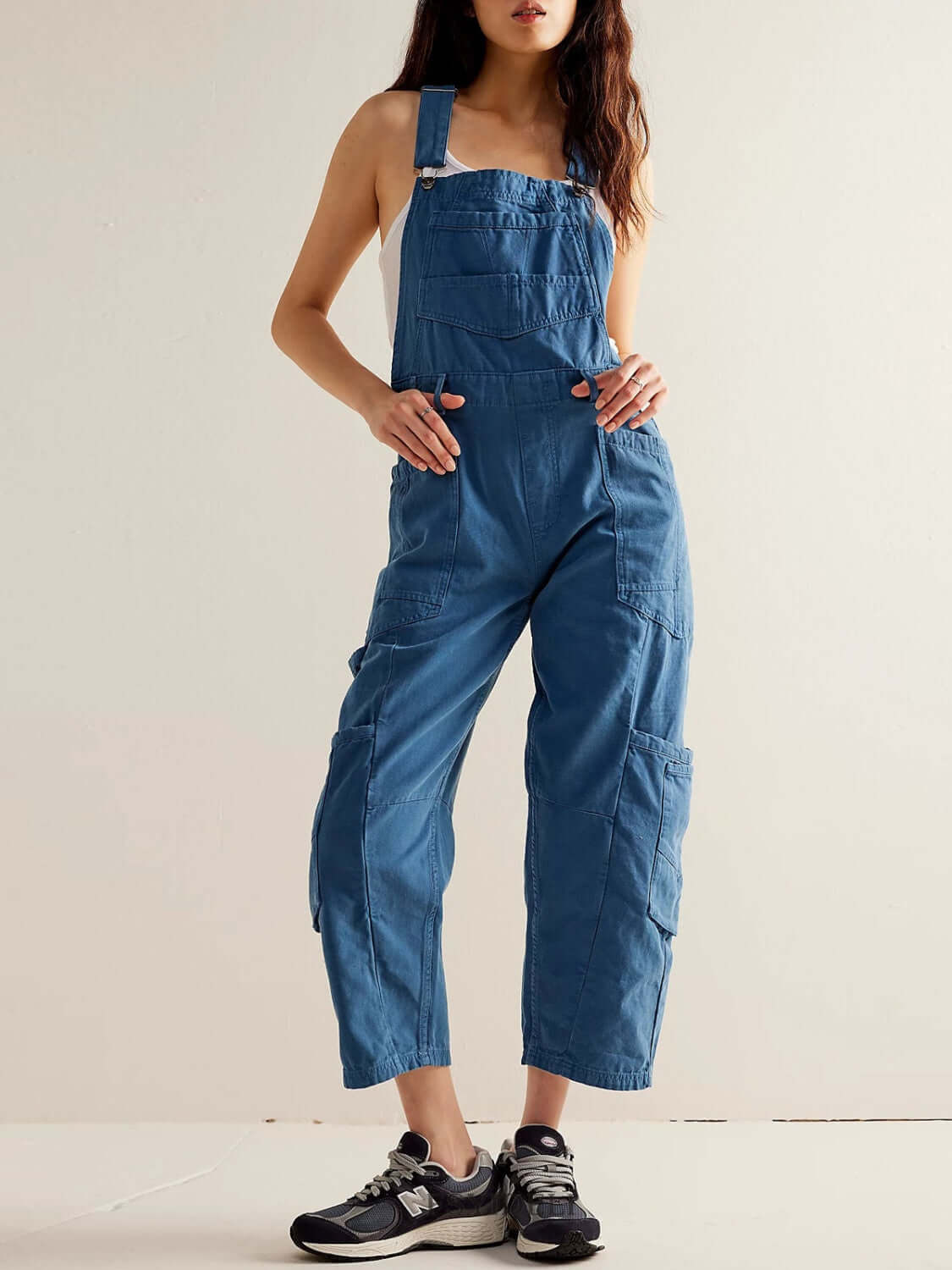 Stylish woman in medium blue Bella Road Pocketed Wide Strap Denim Overalls, perfect for fashion and function.