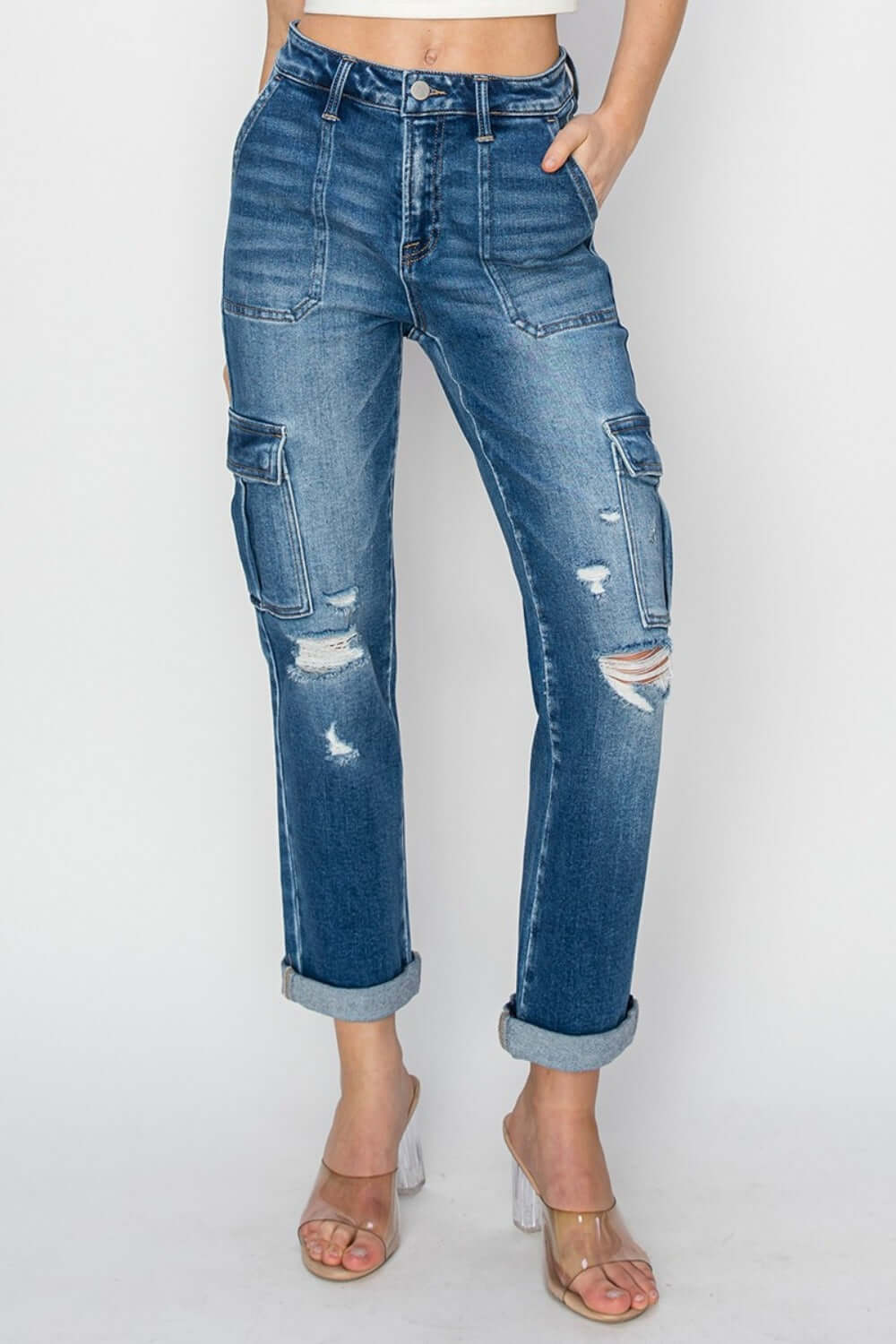 Risen high-rise cargo ankle roll-up straight jeans with pockets and distressed details, showcasing a trendy and laid-back style.