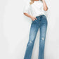 Stylish woman in bytos distressed high rise straight jeans and a white top, showcasing casual elegance and trendy flair.