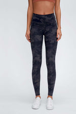 Millennia wide seamless band waist sports leggings in camouflage pattern, perfect for workouts and activities.