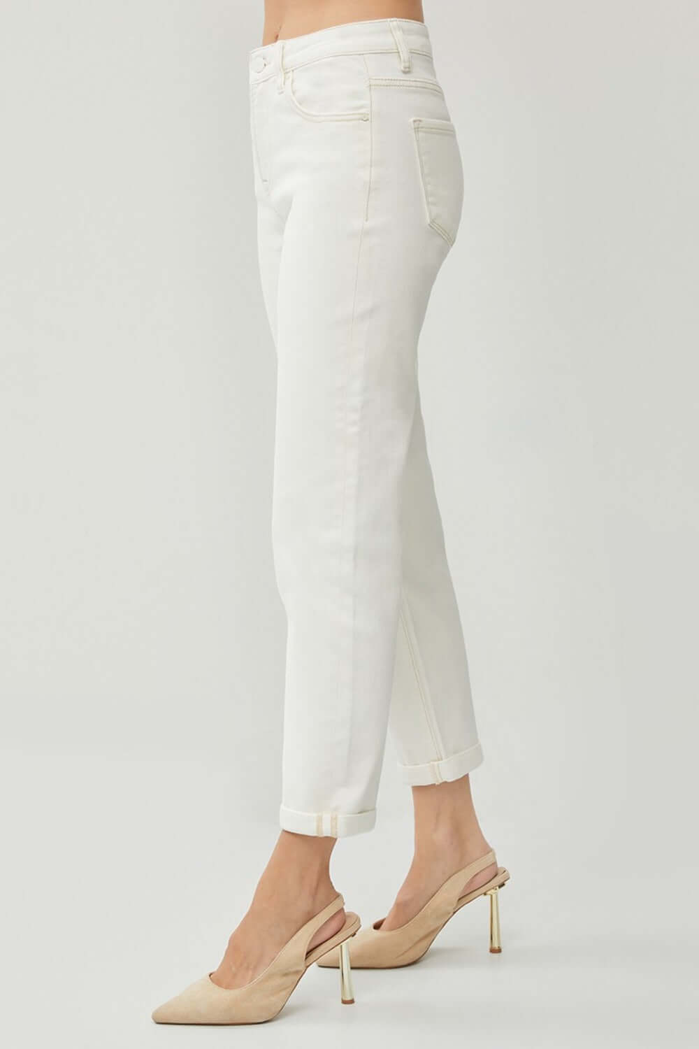 White RISEN High Waist Rolled Hem Straight Jeans showcasing side profile with comfortable fit and trendy rolled hem.